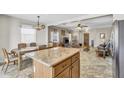 Open-concept living and dining area with tile flooring, lots of natural light and neutral paint at 1992 E Shetland Dr, San Tan Valley, AZ 85140