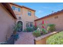 Picturesque outdoor patio featuring comfortable seating, vibrant umbrellas, and beautiful landscaping at 20785 W Canyon Dr, Buckeye, AZ 85396