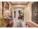 Warm entryway with decorative furnishings leading into the living area of the house at 25609 N 54Th Ln, Phoenix, AZ 85083