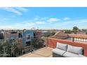 Enjoy city views from this rooftop deck with comfortable outdoor seating at 3428 E Lance Ln, Phoenix, AZ 85018