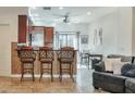 Eat-in kitchen features a breakfast bar with seating and stainless steel appliances at 3428 E Lance Ln, Phoenix, AZ 85018