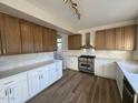 Renovated kitchen featuring granite countertops, custom cabinetry, and a stainless steel range at 4216 E Tether Trl, Phoenix, AZ 85050