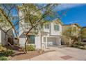 Attractive white two-story home with a two-car garage and well-maintained landscaping in a residential neighborhood at 6451 N 17Th Pl, Phoenix, AZ 85016