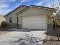 Charming single-story home featuring a two-car garage, low maintenance yard and a neutral color palette at 7321 N 123Rd Dr, Glendale, AZ 85307