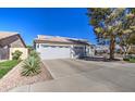 Exterior elevation view of a single-Gathering home with a tile roof and a two-car garage at 792 W Nolan Way, Chandler, AZ 85248