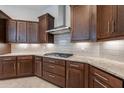 Detailed kitchen with rich cabinetry and stainless steel appliances at 8180 W Silver Spring Way, Florence, AZ 85132