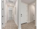 Bright entryway featuring neutral walls, tile floors, and a white front door at 8553 N 175Th Ln, Waddell, AZ 85355