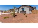 Exterior view of a single Gathering home showing the neutral stucco and rock landscaping at 8553 N 175Th Ln, Waddell, AZ 85355