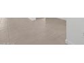 Bright and clean light gray tile flooring for easy maintenance and modern style at 8554 W Trenton Ct, Florence, AZ 85132