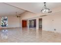 Open-concept living room boasts tile floors, recessed lighting, and a ceiling fan at 8626 N 50Th Ln, Glendale, AZ 85302