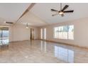 Spacious living room featuring tile floors, recessed lights and a large window at 8626 N 50Th Ln, Glendale, AZ 85302