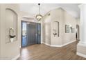 Elegant foyer boasts wood floors and a decorative niche at 8657 E Aster Dr, Scottsdale, AZ 85260