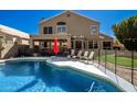 Beautiful backyard pool with a covered patio, perfect for outdoor entertaining and relaxation at 1202 E Desert Broom Way, Phoenix, AZ 85048