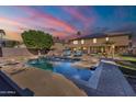 Enjoy a refreshing pool and backyard space, complete with lounge chairs and lush landscaping for relaxation at 12925 W Llano Dr, Litchfield Park, AZ 85340