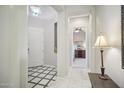 Bright entryway features decorative tile and a view into the living spaces at 12956 W Eagle Ridge Ln, Peoria, AZ 85383