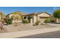 Charming single-story home with well-maintained landscaping and a two-car garage at 13054 W Big Oak St, Peoria, AZ 85383