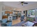 Open-concept living room that flows into the kitchen and breakfast nook at 13054 W Big Oak St, Peoria, AZ 85383