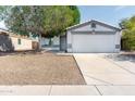 Charming single-Gathering home featuring a two-car garage and low-maintenance desert landscaping at 1793 S Valley Dr, Apache Junction, AZ 85120