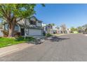 A desirable neighborhood street view showcasing well-maintained homes, mature trees, and a sense of community at 18608 N 4Th Ave, Phoenix, AZ 85027