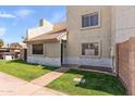 Charming exterior featuring a well-kept lawn and a tiled roof, creating a welcoming atmosphere at 222 W Brown Rd # 57, Mesa, AZ 85201