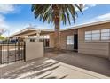 Single story home with covered parking area and secure front entry way at 3611 W Hazelwood St, Phoenix, AZ 85019