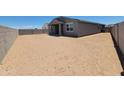 Expansive backyard featuring desert landscaping, framed by block wall for privacy at 3850 N Camden Dr, Florence, AZ 85132