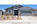 Charming single-story home with neutral stucco, brick accents, and a well-kept xeriscaped front yard at 3850 N Camden Dr, Florence, AZ 85132