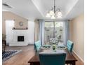 Bright dining area featuring seating for six, a decorative chandelier, and sliding doors at 5726 N 10Th St # 5, Phoenix, AZ 85014