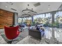 Stylish lobby with modern furnishings, designer lighting, and floor-to-ceiling windows with garden views at 7120 E Kierland Blvd # 601, Scottsdale, AZ 85254