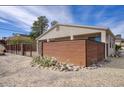 This backyard features a horizontal metal fence, gravel landscaping, and desert plants at 725 W Hermosa Dr, Wickenburg, AZ 85390