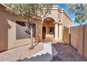 Inviting home entrance with decorative pillars, a tiled walkway, and low-maintenance desert landscaping at 9372 E Aster Dr, Scottsdale, AZ 85260