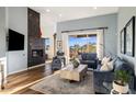 Comfortable living room offers stylish decor, fireplace, and bright natural light at 12026 N 138Th St, Scottsdale, AZ 85259