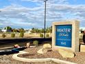 Water Works Condominiums sign at 1645, surrounded by rock features and desert plants at 1645 W Baseline Rd # 2050, Mesa, AZ 85202