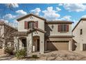 Charming two-story home with a two-car garage and beautiful desert landscaping at 1998 S Starling Dr, Gilbert, AZ 85295