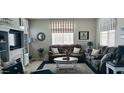 Comfortable living room featuring modern decor, neutral paint, and natural light at 266 S Eliseo Felix Jr Way, Avondale, AZ 85323