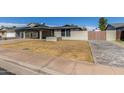 Charming single-story home with a covered carport and low maintenance desert landscaping at 28 W Hillside St, Mesa, AZ 85201