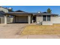 Charming single-story home with a covered carport and low maintenance desert landscaping at 28 W Hillside St, Mesa, AZ 85201