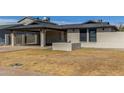 Charming single-story home with a covered carport and low maintenance desert landscaping at 28 W Hillside St, Mesa, AZ 85201