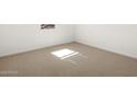 Cozy carpeted bedroom filled with natural light from the bright window at 3782 N Camden Dr, Florence, AZ 85132
