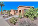 Attractive home with desert landscaping, showcasing a beautiful combination of textures and colors at 42432 W North Star Dr, Maricopa, AZ 85138