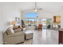 Inviting living room featuring high ceilings, a large window, and access to the outdoor patio at 4665 S Palacio Way, Gold Canyon, AZ 85118