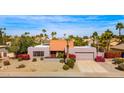 Aerial view of a lovely one-story home with a red tile roof and well-maintained desert landscaping at 5024 E Le Marche Ave, Scottsdale, AZ 85254