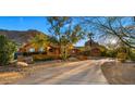 Beautiful hillside home surrounded by desert landscape, offering both privacy and stunning views at 5567 E Mcdonald Dr, Paradise Valley, AZ 85253