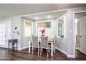 Bright dining area featuring a charming bay window and a sleek, modern table setting at 6177 S Sawgrass Dr, Chandler, AZ 85249