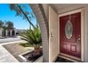 A welcoming view of the front door with a security screen, with desert landscaping at 8230 E Valley Vista Dr, Scottsdale, AZ 85250