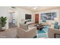 Cozy living room features a plush rug, bright natural light, and comfortable furniture, creating a relaxing atmosphere at 1649 E Dana Ave, Mesa, AZ 85204