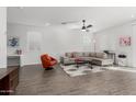 Spacious living room with stylish furniture, wood-look flooring, and neutral decor at 17339 W Paraiso Ln, Surprise, AZ 85387