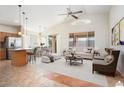 This staged living room boasts bright, airy with high ceilings and large windows at 18123 W Hayden Dr, Surprise, AZ 85374