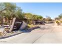 View of the Grayhawk community entrance sign near well-maintained landscaping at 19700 N 76Th St # 1080, Scottsdale, AZ 85255