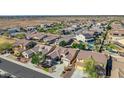 Expansive aerial view of a suburban neighborhood featuring houses with private pools and desert landscaping at 22722 N 120Th Ln, Sun City, AZ 85373
